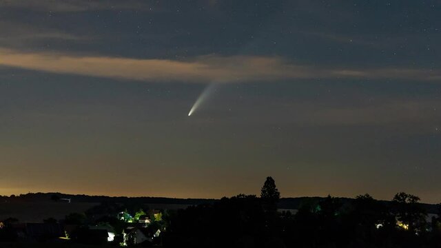 Babstadt, Germany - July 12, 2020: Comet C/2020 F3 (Neowise) moving low over the horizon, about 1 hour after sunset.

