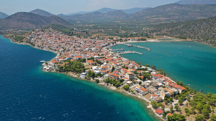 Naklejka na ściany i meble Aerial drone photo of picturesque city of Ermioni built in peninsula with forest of Bistis at the end, Argolida, Peloponnese, Greece