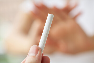 Stop smoking, close up of woman breaking cigarette