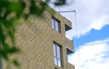 mineral wool slabs covering modern house facade