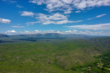 Aerial view of mountains covered with coniferous forests