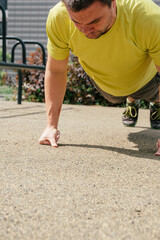 Determined Sportsman during fitness training outdoor