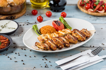Turkish cuisine chicken wings grill. Grilled chicken wings on wooden background