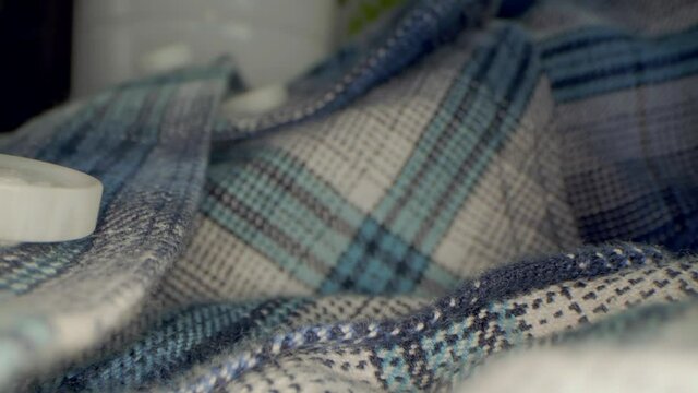 Close up macro view of the shirt with buttons. Sliding down the shirt. Texture textile.	