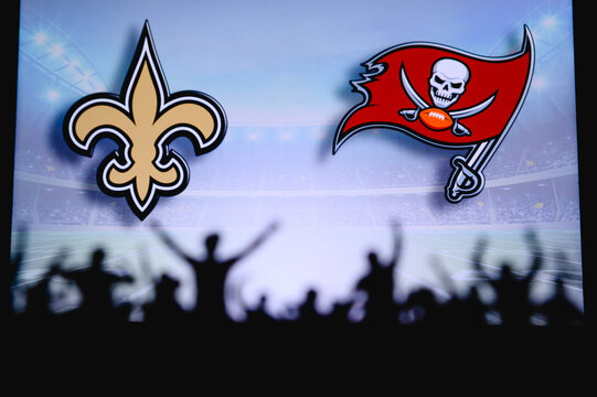 New Orleans Saints Vs. Tampa Bay Buccaneers. Fans Support On NFL Game. Silhouette Of Supporters, Big Screen With Two Rivals In Background.