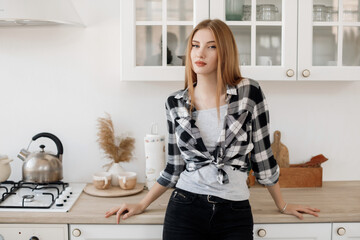 Portrait of a young caucasian woman at home