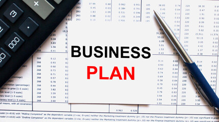 Naklejka na ściany i meble Work smarter text Business Plan on white sheet with pen, calculator and tables