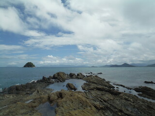 Fototapeta na wymiar Rocky island on the coast 