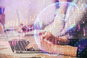 Multi exposure of woman hands typing on computer and financial chart hologram drawing. Stock market...