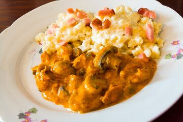 Paprika stew from chicken breast and mushroom and dumpling