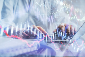 Double exposure of woman hands typing on computer and forex chart hologram drawing. Stock market invest concept.