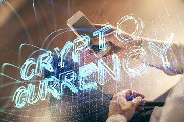 Double exposure of man's hands holding and using a phone and crypto currency blockchain theme drawing.