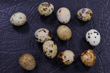 Fototapeta premium fresh quail eggs isolated on dark black background