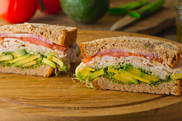 Sandwiches. Tuna Salad. Chicken Salad. Served on slices of white, rye, and whole grain bread with lettuce and tomato. Traditional American lunch or snack favorite. 