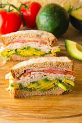 Sandwiches. Tuna Salad. Chicken Salad. Served on slices of white, rye, and whole grain bread with lettuce and tomato. Traditional American lunch or snack favorite. 