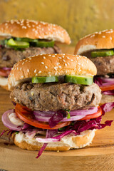 Hamburger made with lamb meat. Lamb burger. Classic traditional greek variation of the classic american burger tradition. seasoned lamb meat with feta cheese, red onion and greek mayo. 