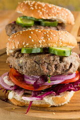 Hamburger made with lamb meat. Lamb burger. Classic traditional greek variation of the classic american burger tradition. seasoned lamb meat with feta cheese, red onion and greek mayo. 