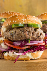 Hamburger made with lamb meat. Lamb burger. Classic traditional greek variation of the classic american burger tradition. seasoned lamb meat with feta cheese, red onion and greek mayo. 