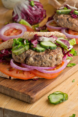Hamburger made with lamb meat. Lamb burger. Classic traditional greek variation of the classic american burger tradition. seasoned lamb meat with feta cheese, red onion and greek mayo. 