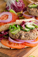 Hamburger made with lamb meat. Lamb burger. Classic traditional greek variation of the classic american burger tradition. seasoned lamb meat with feta cheese, red onion and greek mayo. 