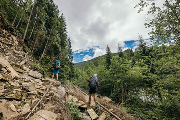 A person standing on a rocky hill