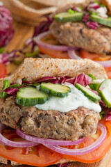 Hamburger made with lamb meat. Lamb burger. Classic traditional greek variation of the classic american burger tradition. seasoned lamb meat with feta cheese, red onion and greek mayo. 