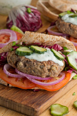 Hamburger made with lamb meat. Lamb burger. Classic traditional greek variation of the classic american burger tradition. seasoned lamb meat with feta cheese, red onion and greek mayo. 