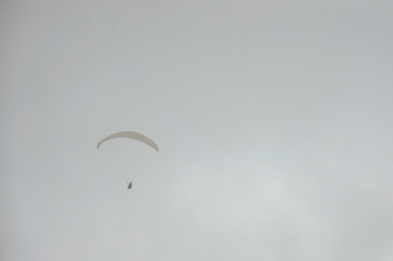 paragliding in the cloudy sky