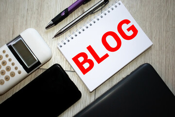 cloud of words or tags related to blogging and blog design on a digital tablet with cup of coffee