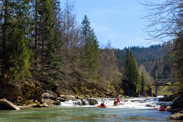 mountain river rafting competition between teams