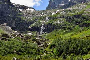 Beautiful view of the Caucasus mountains. In the background are waterfalls from the snowy peaks of the Caucasus.