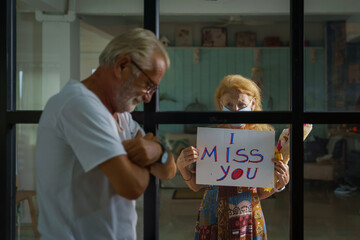 senior couple feeling sorrow from isolation each other during covid-19