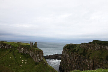 Fototapeta na wymiar Beautiful coastline of Northern Ireland, featuring clifs, waves and water