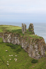 Beautiful coastline of Northern Ireland, featuring clifs, waves and water