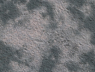 Stone wall texture. Dark cement background with light gray spots in the middle, closeup.