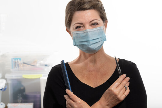 Female Salon Worker Wearing Facial Mask Because Of Covid 19