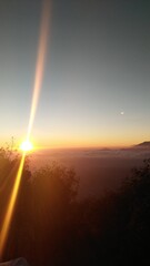 SUNRISE FROM TOP OF MOUNTAIN