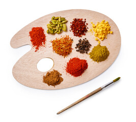 Set of spices on wooden board. Top view of palette with colorful spices isolated on white...