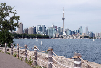 View of the Toronto skyline and Lake Ontario from a boardwalk