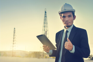 Asian Man Business use tablet check on site construction
