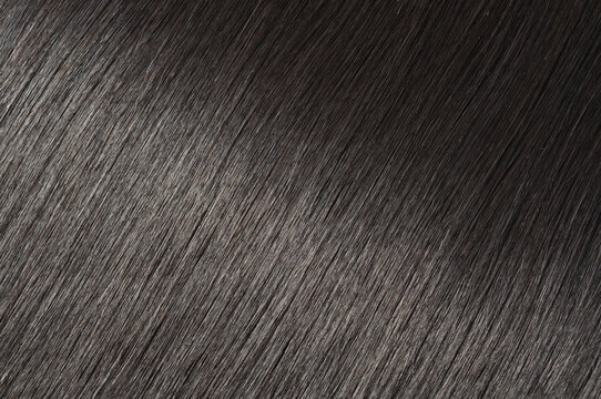 closeup of multiple pieces clip in straight black human hair extensions
