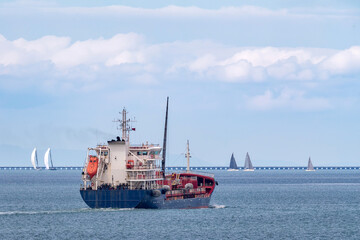 Fototapeta premium Chemical and Oil products tanker ship sailing out of a harbor.