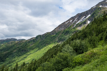 Rocky slopes with scraps of snow hanging on