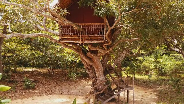Crane shot of beautiful romantic getaway treehouse on the beach in Madagascar
