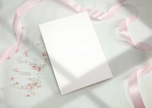 Invitation Mockup. Top view blank card on white background and window shadow with clipping path.