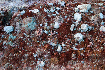 textures of various clay layers underground in  clay quarry after  geological study of the soil. colored layers of clay and stone in  section of the earth, different rock formations and soil layers.