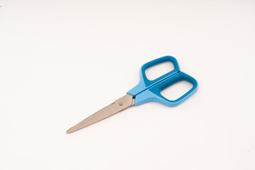scissor with plastic handle on white background.