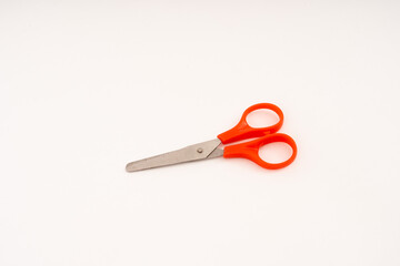 scissor with plastic handle on white background.