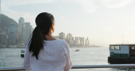 Woman looks at city in Hong Kong