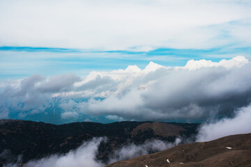 View of the clouds from above in the mountains